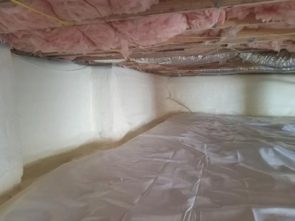 Crawl space encapsulation with closed-cell spray foam for Commercial Roof Restoration in New London